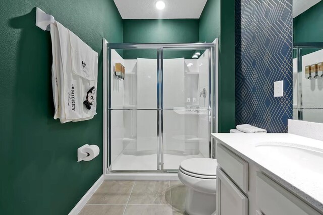 4441 Ganesha Loop, Kissimmee, FL 34746 - full bath with a shower stall, tile patterned flooring, toilet, and vanity