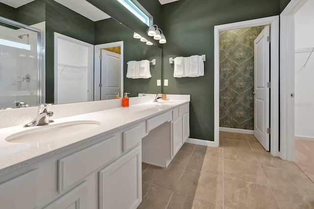 4441 Ganesha Loop, Kissimmee, FL 34746 - full bathroom featuring a walk in closet, a shower stall, tile patterned flooring, and double vanity