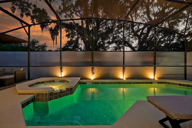 4441 Ganesha Loop, Kissimmee, FL 34746 - view of swimming pool featuring a pool with connected hot tub and glass enclosure