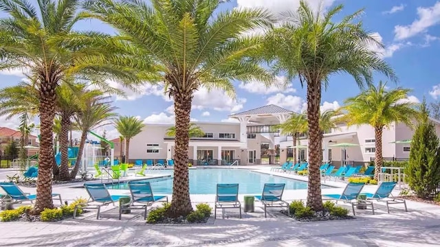 4441 Ganesha Loop, Kissimmee, FL 34746 - community pool featuring a patio