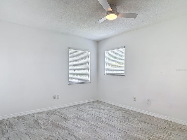 1113 Leeward Dr, Deltona, FL 32738 - unfurnished room with a textured ceiling, a ceiling fan, and baseboards