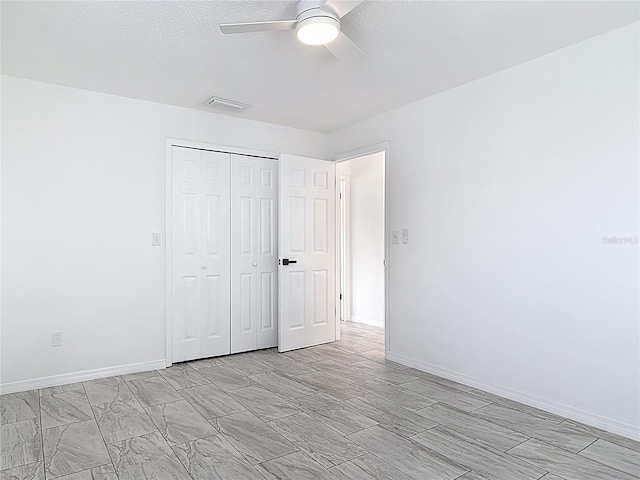 1113 Leeward Dr, Deltona, FL 32738 - unfurnished bedroom with a closet, ceiling fan, and baseboards
