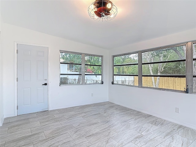 1113 Leeward Dr, Deltona, FL 32738 - unfurnished room with baseboards and light marble finish flooring