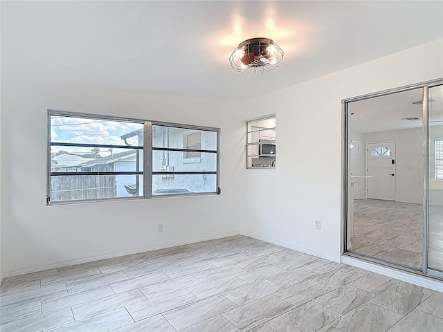 1113 Leeward Dr, Deltona, FL 32738 - unfurnished room featuring light marble finish floors and baseboards
