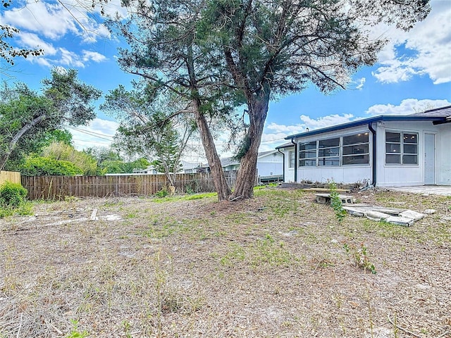1113 Leeward Dr, Deltona, FL 32738 - view of yard featuring fence and a sunroom