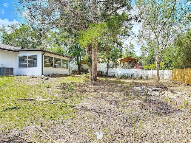 1113 Leeward Dr, Deltona, FL 32738 - fenced yard featuring central AC unit