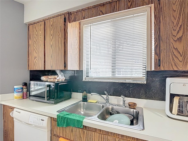 1803 Foxhall Cir Unit 1803, Kissimmee, FL 34741 - kitchen featuring white dishwasher, stainless steel microwave, light countertops, and tasteful backsplash