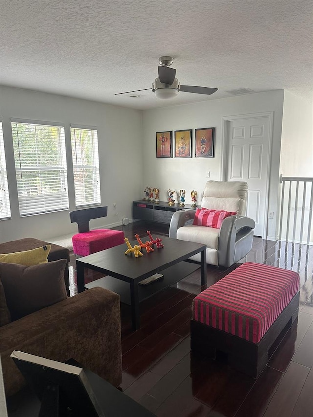10148 Malpas Pt, Orlando, FL 32832 - living area with wood finished floors, a ceiling fan, and a textured ceiling