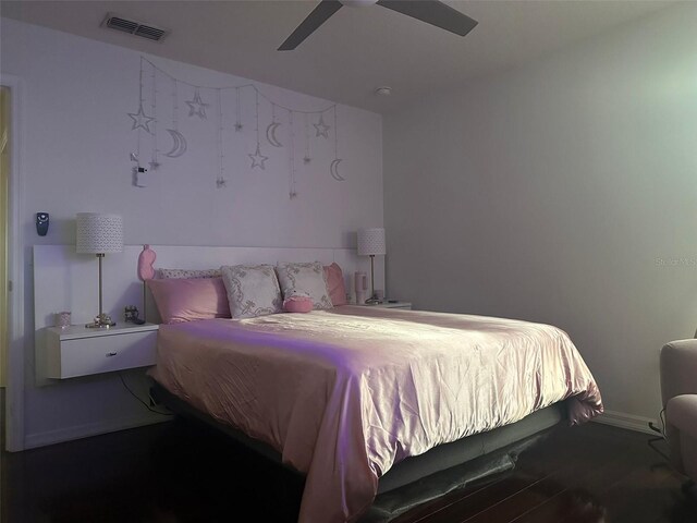 10148 Malpas Pt, Orlando, FL 32832 - bedroom featuring a ceiling fan, wood finished floors, and baseboards