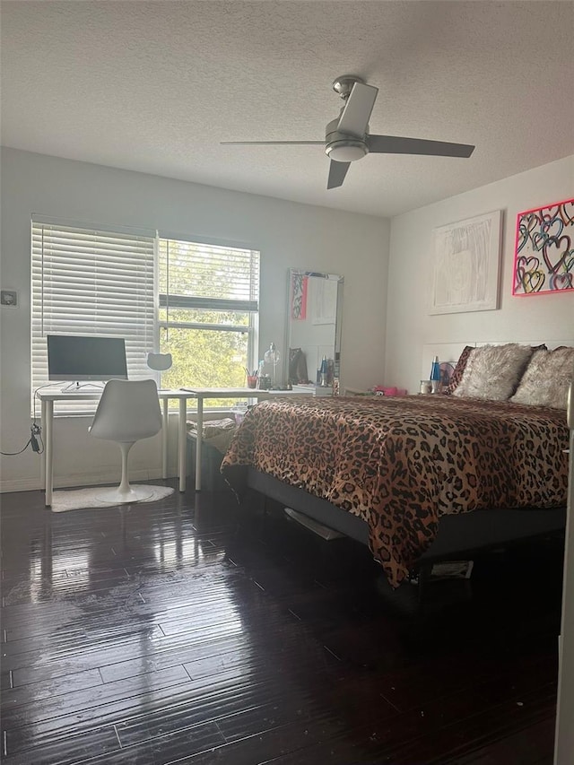 10148 Malpas Pt, Orlando, FL 32832 - bedroom with a textured ceiling, wood-type flooring, and a ceiling fan