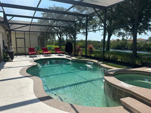 10148 Malpas Pt, Orlando, FL 32832 - view of pool with a pool with connected hot tub, a patio area, glass enclosure, and a water view