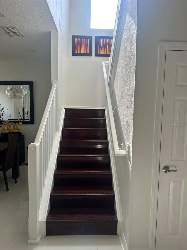 10148 Malpas Pt, Orlando, FL 32832 - stairway featuring tile patterned flooring