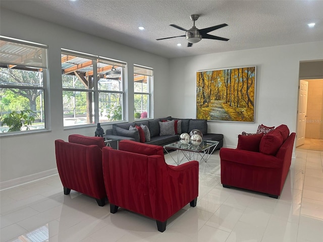 10148 Malpas Pt, Orlando, FL 32832 - living room with a textured ceiling, healthy amount of natural light, recessed lighting, ceiling fan, and baseboards