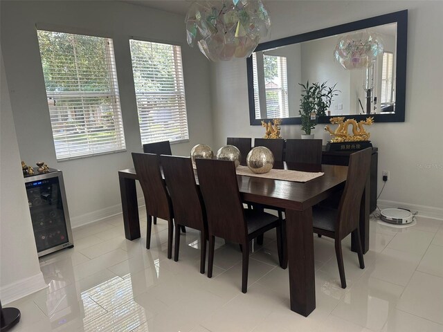 10148 Malpas Pt, Orlando, FL 32832 - dining area featuring beverage cooler and baseboards