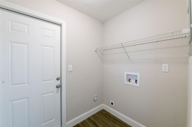 4226 Kelly Miller Ct, Orlando, FL 32811 - washroom featuring hookup for an electric dryer, baseboards, washer hookup, a textured ceiling, and dark wood finished floors