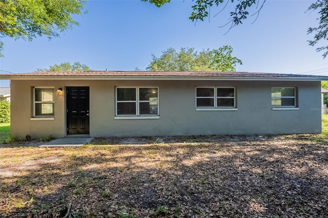 4226 Kelly Miller Ct, Orlando, FL 32811 - view of front of house featuring stucco siding and roof with shingles