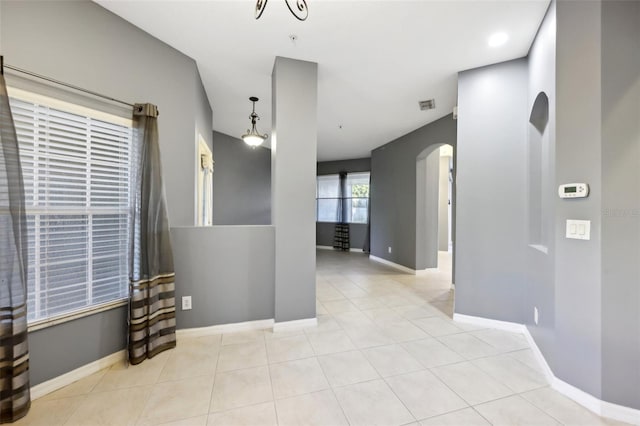 585 Cruz Bay Cir, Winter Springs, FL 32708 - unfurnished room featuring arched walkways and tile patterned flooring