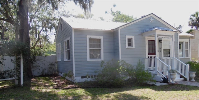 1102 S Oak Ave, Sanford, FL 32771 - view of front of home with crawl space and metal roof