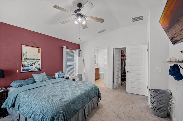 503 Meadow Pointe Dr, Haines City, FL 33844 - bedroom featuring vaulted ceiling, light colored carpet, a spacious closet, ensuite bath, and a ceiling fan