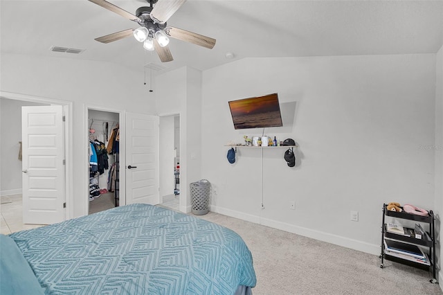 503 Meadow Pointe Dr, Haines City, FL 33844 - bedroom with lofted ceiling, baseboards, a walk in closet, a ceiling fan, and light colored carpet