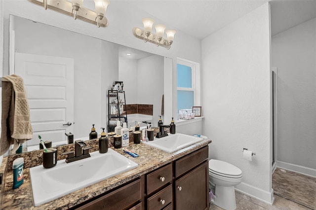 503 Meadow Pointe Dr, Haines City, FL 33844 - bathroom featuring toilet, double vanity, baseboards, and a tub