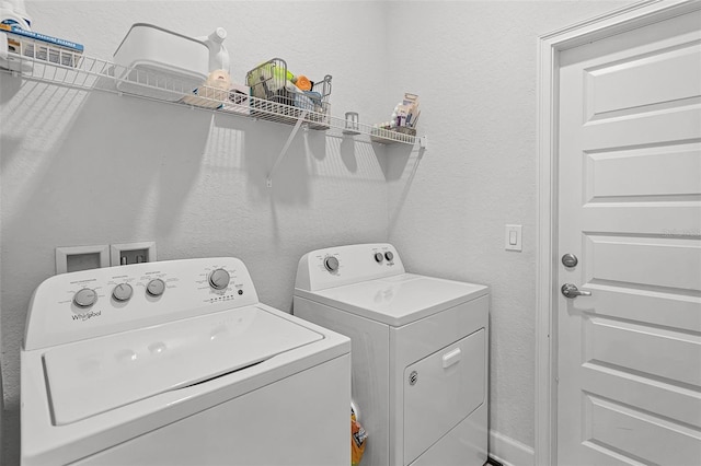 503 Meadow Pointe Dr, Haines City, FL 33844 - washroom with independent washer and dryer and a textured wall