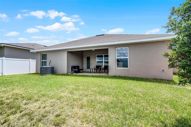 503 Meadow Pointe Dr, Haines City, FL 33844 - rear view of house featuring stucco siding, a patio area, and cooling unit