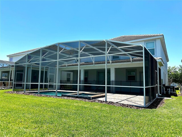 1513 Maidstone Ct, Davenport, FL 33896 - rear view of property featuring a yard, a patio, an outdoor pool, and a lanai