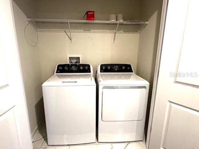1513 Maidstone Ct, Davenport, FL 33896 - clothes washing area featuring washer and clothes dryer