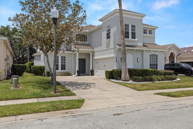 166 Minniehaha Cir, Haines City, FL 33844 - view of front of home featuring driveway, stucco siding, a front yard, and an attached garage