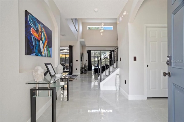 166 Minniehaha Cir, Haines City, FL 33844 - entryway featuring stairs, baseboards, and marble tiled flooring