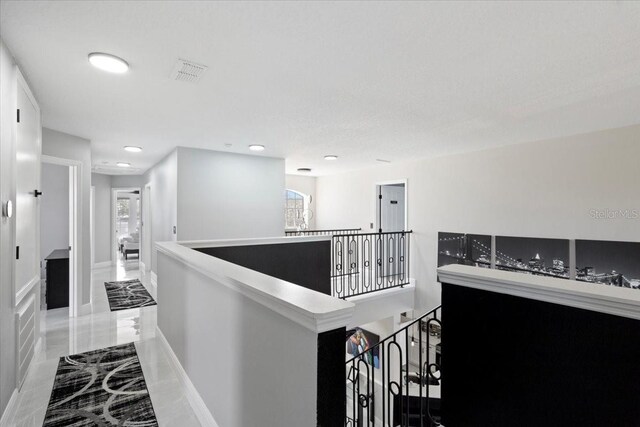 166 Minniehaha Cir, Haines City, FL 33844 - hall featuring an upstairs landing, recessed lighting, baseboards, and marble finish floors