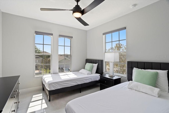 166 Minniehaha Cir, Haines City, FL 33844 - bedroom with baseboards and a ceiling fan