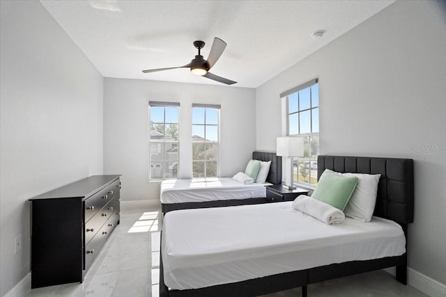 166 Minniehaha Cir, Haines City, FL 33844 - bedroom featuring baseboards and ceiling fan