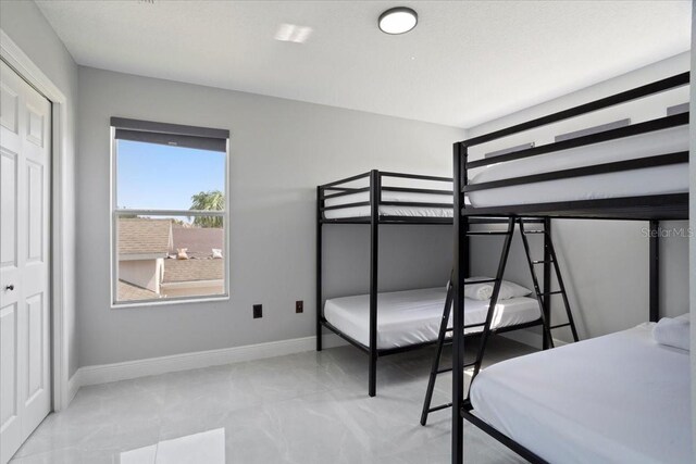 166 Minniehaha Cir, Haines City, FL 33844 - bedroom with marble finish flooring and baseboards