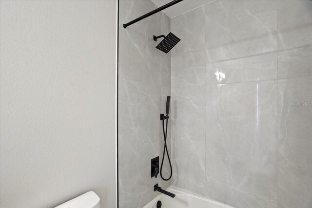 166 Minniehaha Cir, Haines City, FL 33844 - bathroom featuring toilet and tub / shower combination