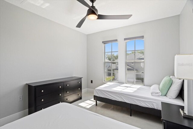 166 Minniehaha Cir, Haines City, FL 33844 - carpeted bedroom with a ceiling fan and baseboards