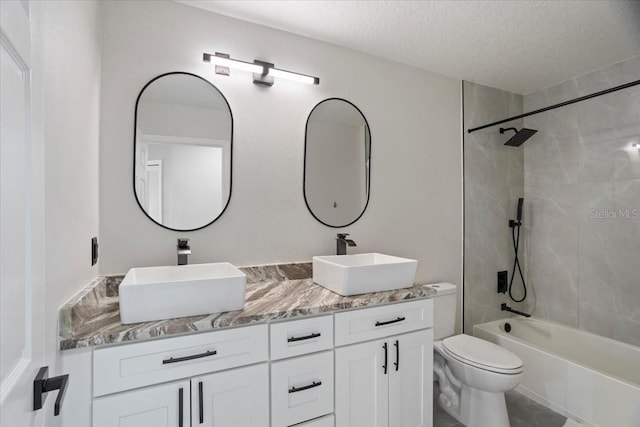 166 Minniehaha Cir, Haines City, FL 33844 - full bath featuring toilet, double vanity, a textured ceiling, and shower / bath combination