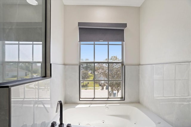 166 Minniehaha Cir, Haines City, FL 33844 - bathroom with a whirlpool tub and healthy amount of natural light