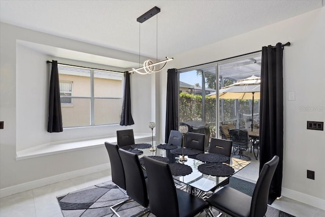 166 Minniehaha Cir, Haines City, FL 33844 - dining room with baseboards and tile patterned floors