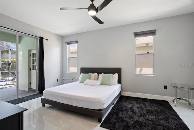 166 Minniehaha Cir, Haines City, FL 33844 - bedroom featuring access to exterior, a ceiling fan, and baseboards