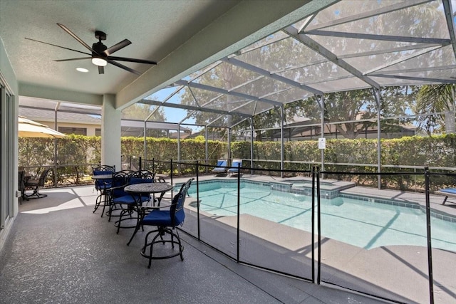 166 Minniehaha Cir, Haines City, FL 33844 - view of swimming pool with a patio, a pool with connected hot tub, ceiling fan, and glass enclosure