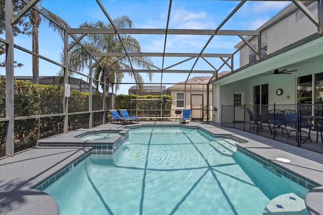 166 Minniehaha Cir, Haines City, FL 33844 - view of swimming pool with ceiling fan, a patio, a pool with connected hot tub, and glass enclosure
