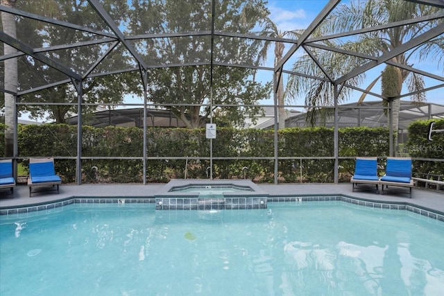 166 Minniehaha Cir, Haines City, FL 33844 - view of swimming pool with glass enclosure, a pool with connected hot tub, and a patio