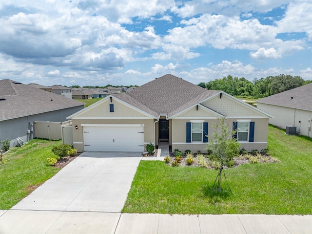 view of front of house with a garage, driveway, stucco siding, and a front yard