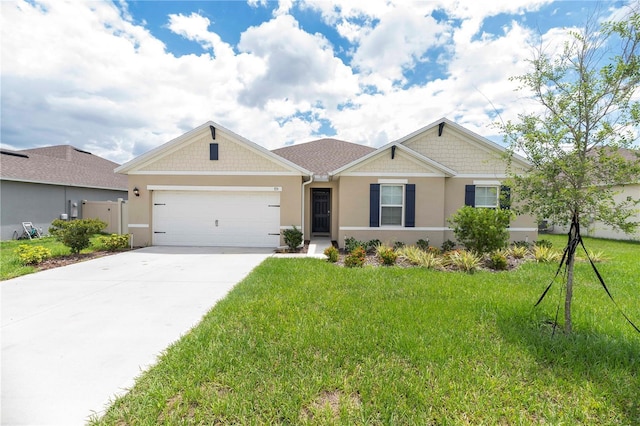view of front of property featuring stucco siding, a garage, concrete driveway, and a front lawn