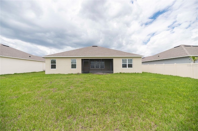 rear view of house with stucco siding