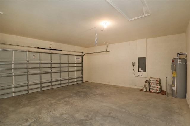 garage featuring water heater and electric panel