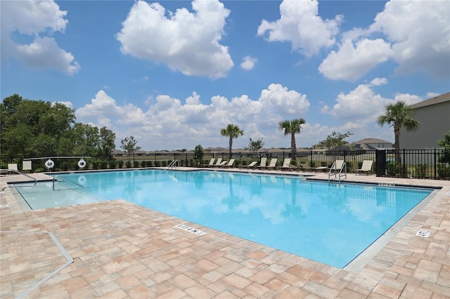 community pool with a patio