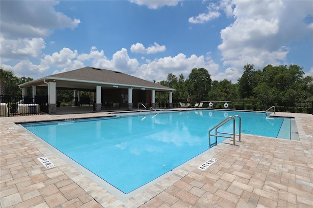 community pool with a patio area